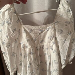 Babydoll style mini dress. White with blue flowers.